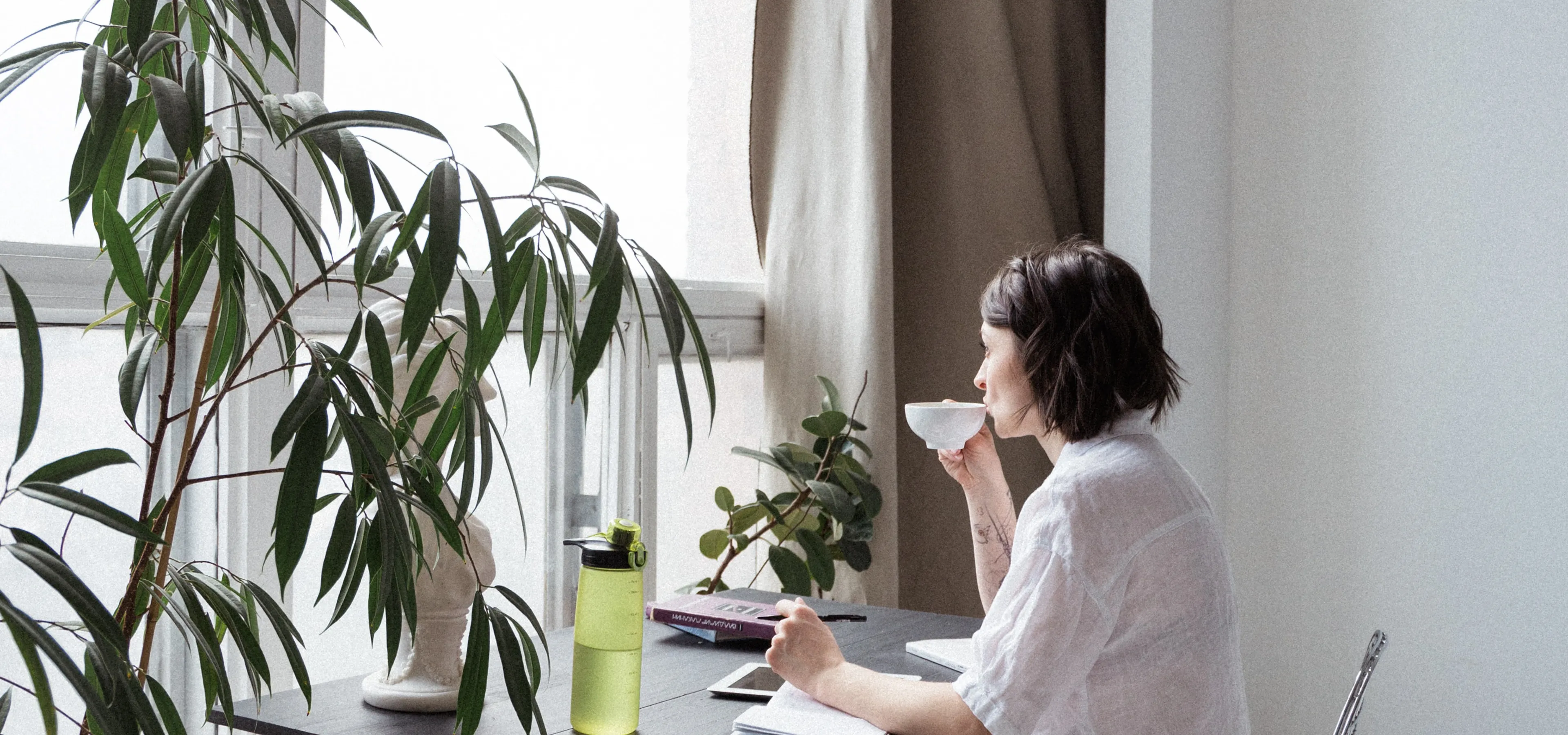 Working from home woman drinking coffee