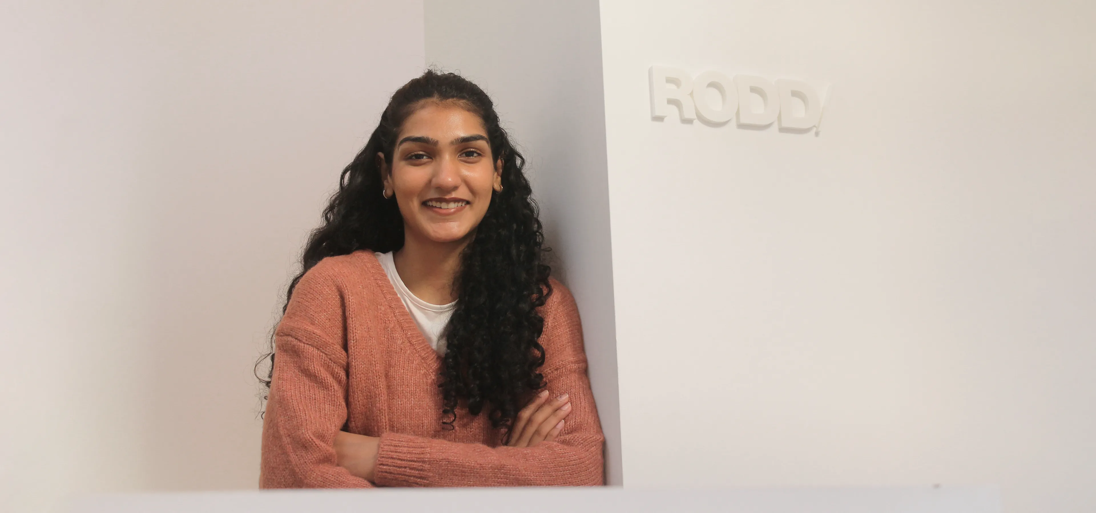 Sakshi Seth pictured in the studio next to Rodd logo