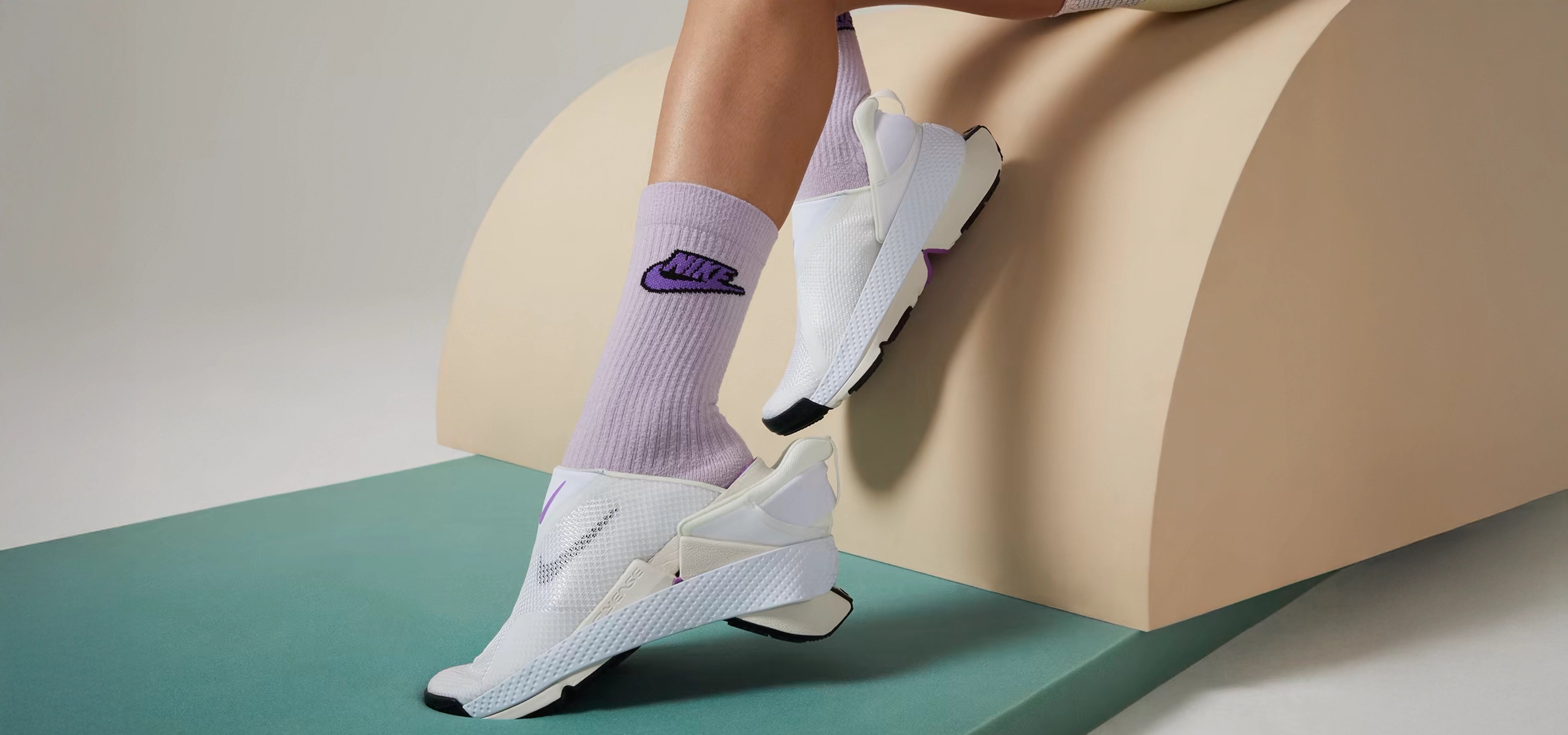 Nike FlyEase shoes being taken off with the other foot