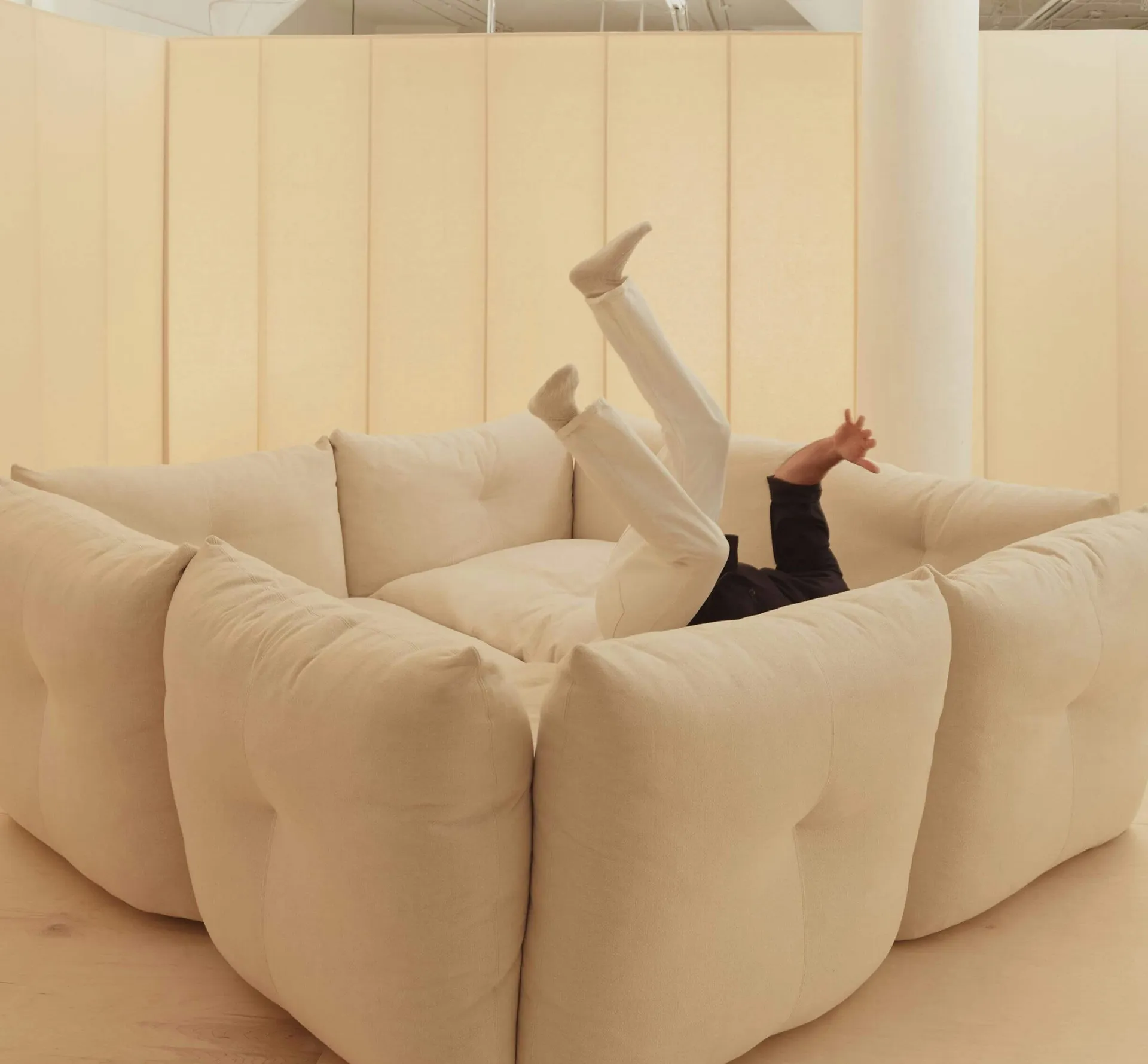 Person jumping onto a soft sofa
