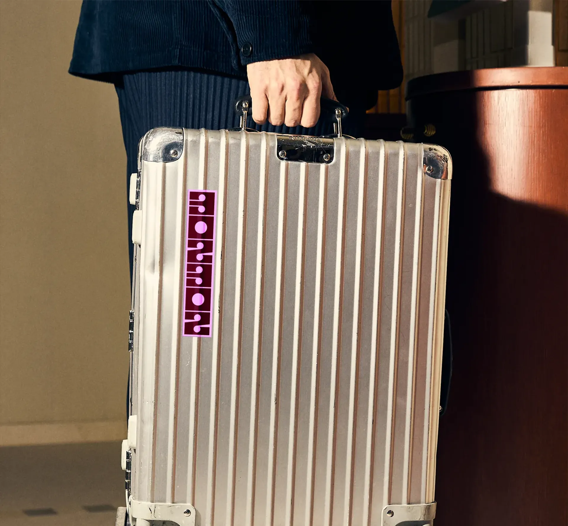 NowNow graphics on a suitcase