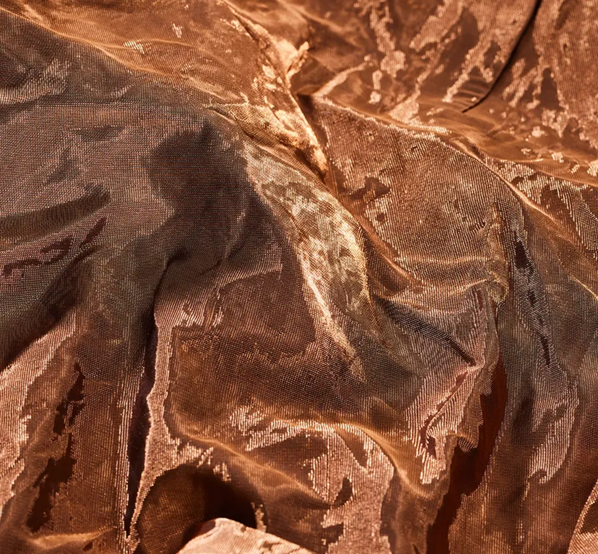 closeup of a woven copper fabric