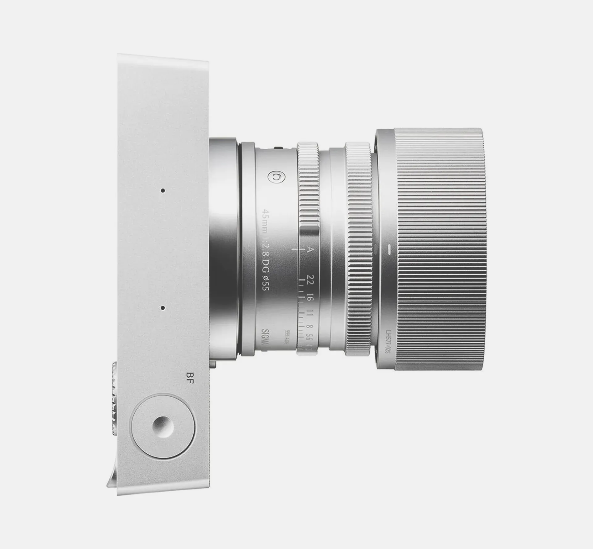 Silver camera on light grey background